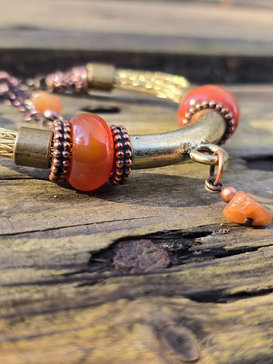 Image d'illustration du produit Bracelet tressé doré et cornalines