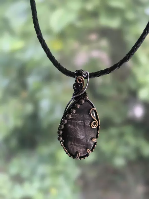 Image d'illustration du produit Pendentif réversible charoïte et hypersthène